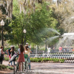 trumpet player girls on bike forsyth park fountain