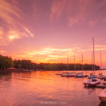 lake norman blythe landing park sunset with sailboats