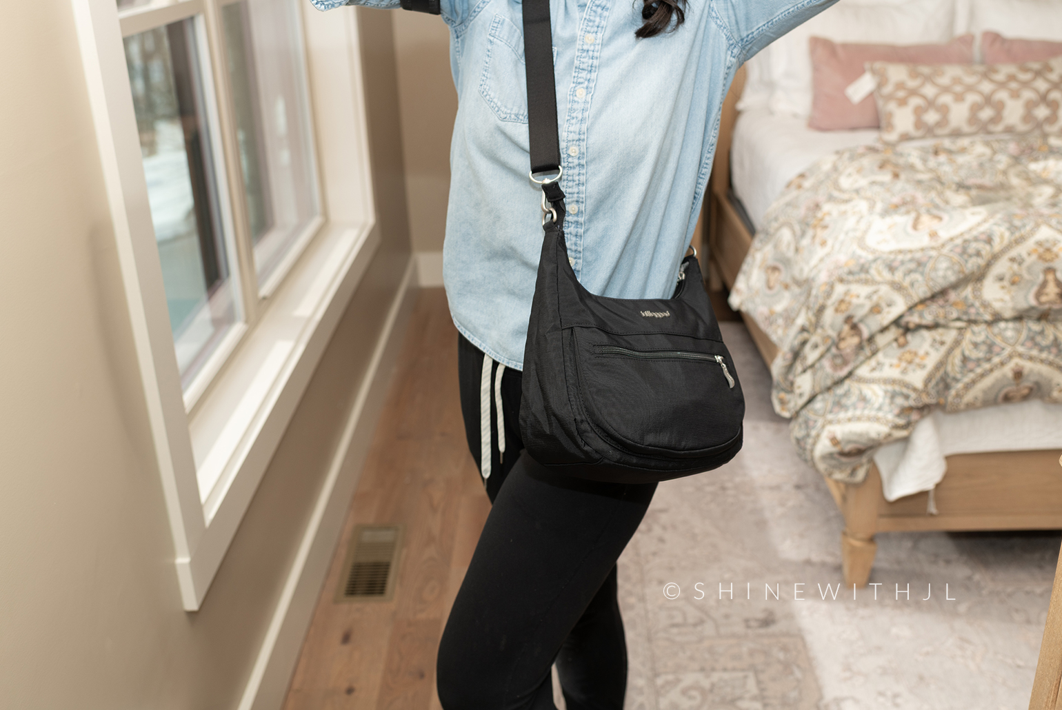 Shine with Jennifer Leigh wearing the Baggallini Modern Half Moon Crossbody Travel Purse when packed.