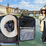 My carry-on luggage opened to show what I packed plus an outfit I wore during a spring trip to Italy