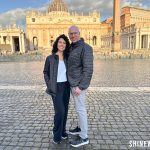 Couple standing in front of St. Peter’s Basilica at sunrise during 1 day Vatican itinerary