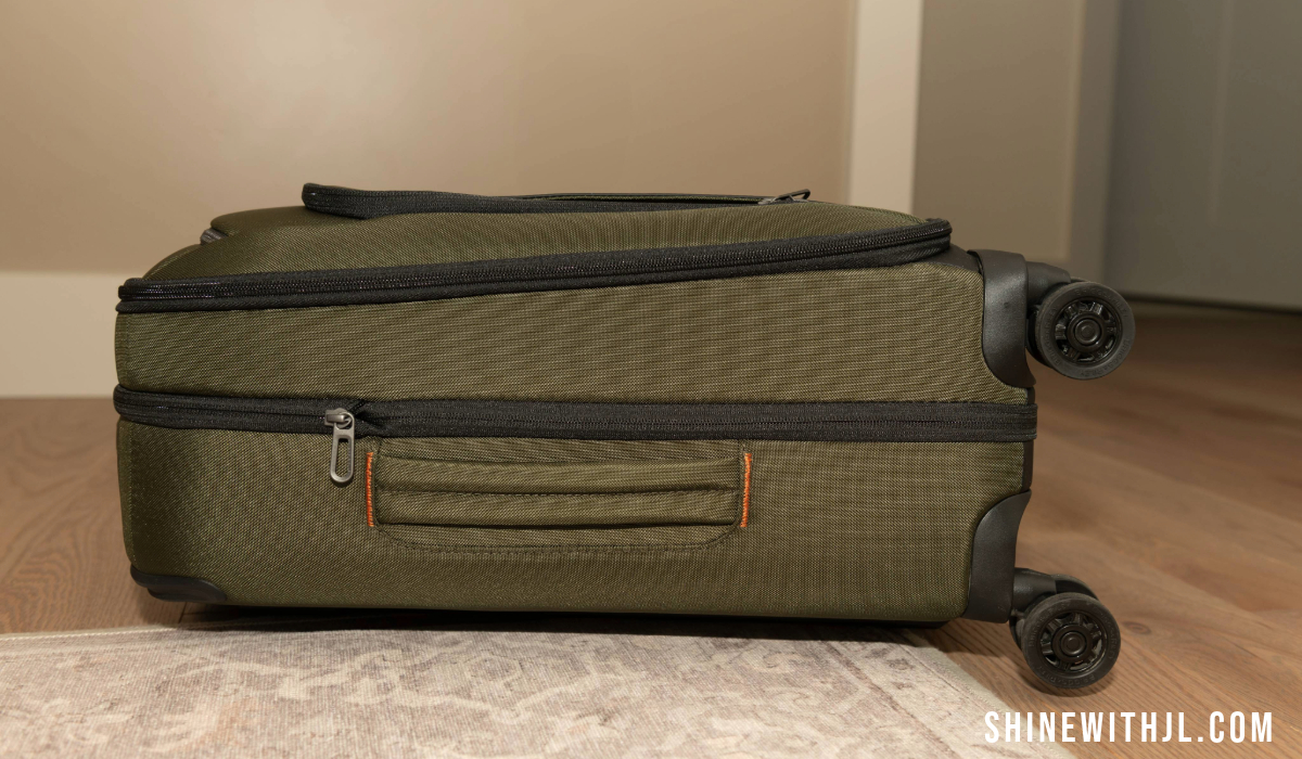 Side profile of Briggs & Riley carry-on luggage for Italy with compression expansion zipper visible