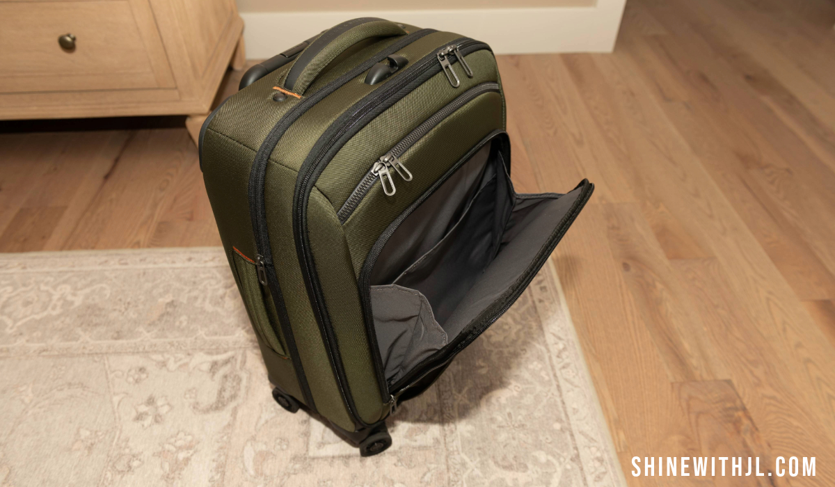 Upright Briggs & Riley carry-on luggage for Italy with zippered front compartment visible