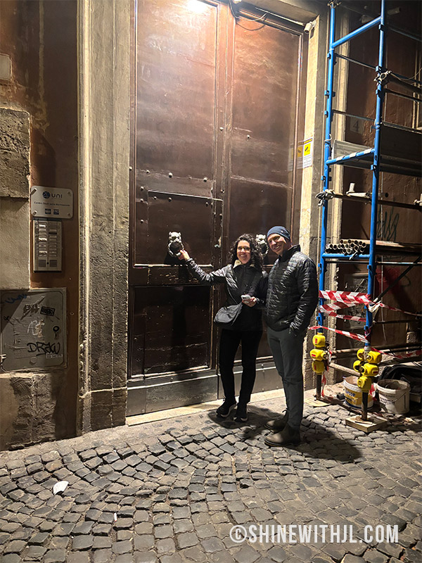 Couple entering Little Queen Pantheon at night near the Pantheon, Rome