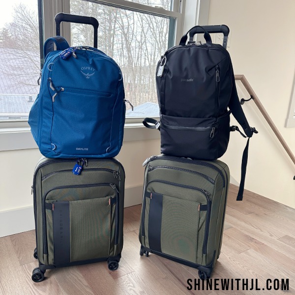 Osprey backpack and PacSafe backpack on Briggs and Riley Carry-On Suitcases