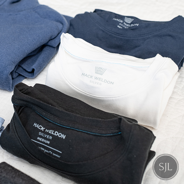 3 Mack Weldon SILVER t-shirts folded in black, white and navy. Men’s Italy spring packing list.