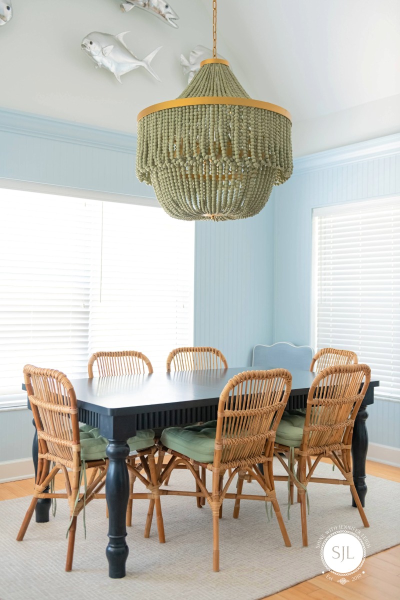 French Coastal Dining Room Anna Maria Island Rental French coastal dining room with blue board and batten wall inside an Anna Maria Island rental