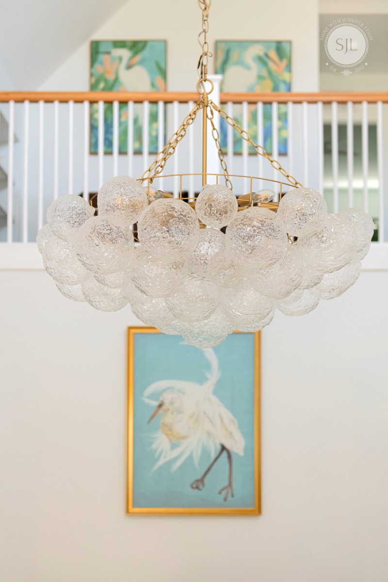 French coastal kitchen lighting with oversized bubble chandelier over kitchen island